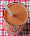 Vegetable Smoothie with Carrots, Onions, Parsley, Tomatoes, and Zucchini
