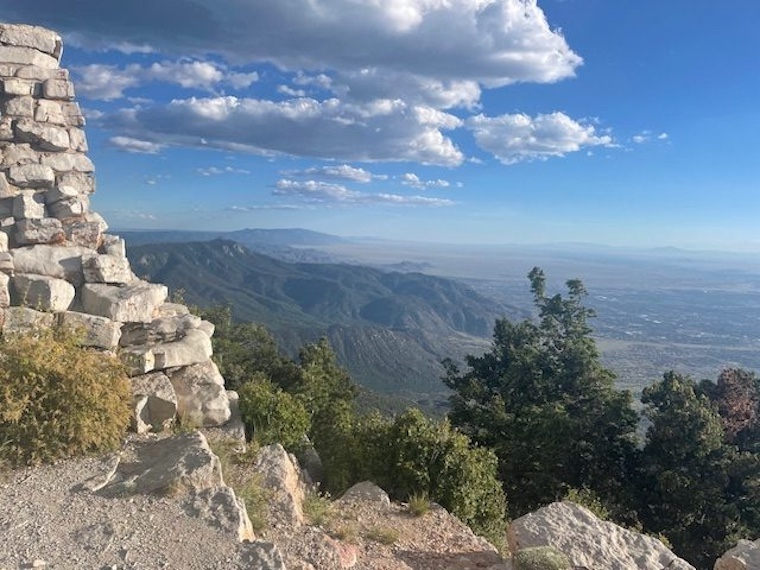 view of wall, sky, and landscape