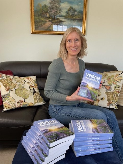 Angela Crawford holding her book