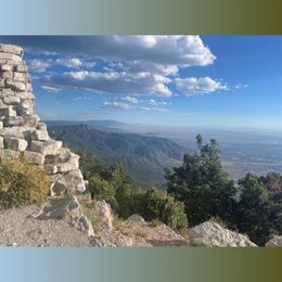 view of wall, sky, and landscape
