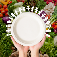 people holding hands around a plate